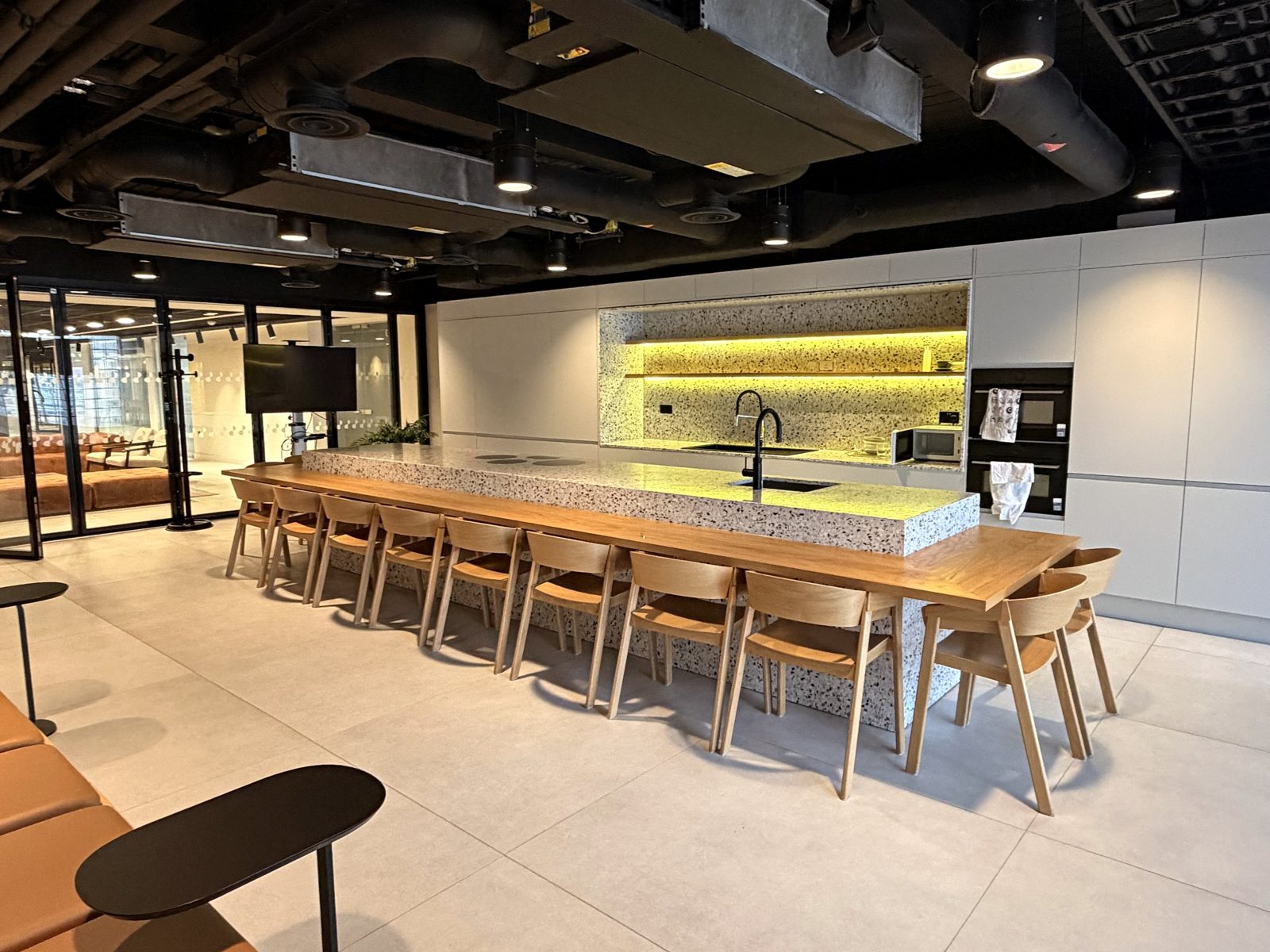 Long table and island in the kitchen studio
