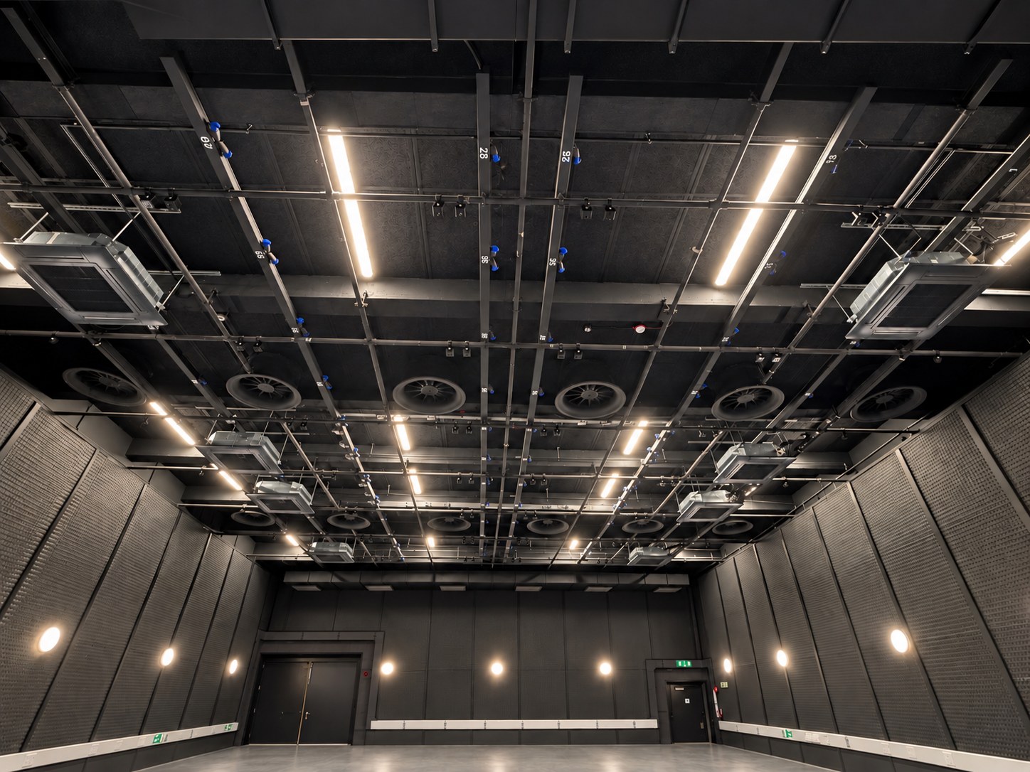 The Studio 1 lighting grid, with the vehicle doors at the far end of the stage